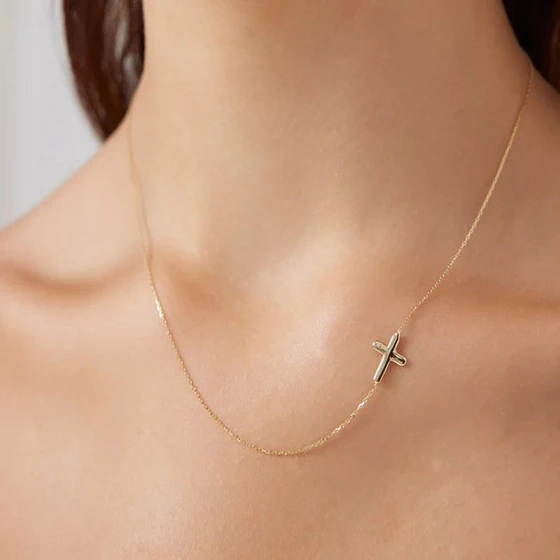 sideways-cross-necklace-1.webp